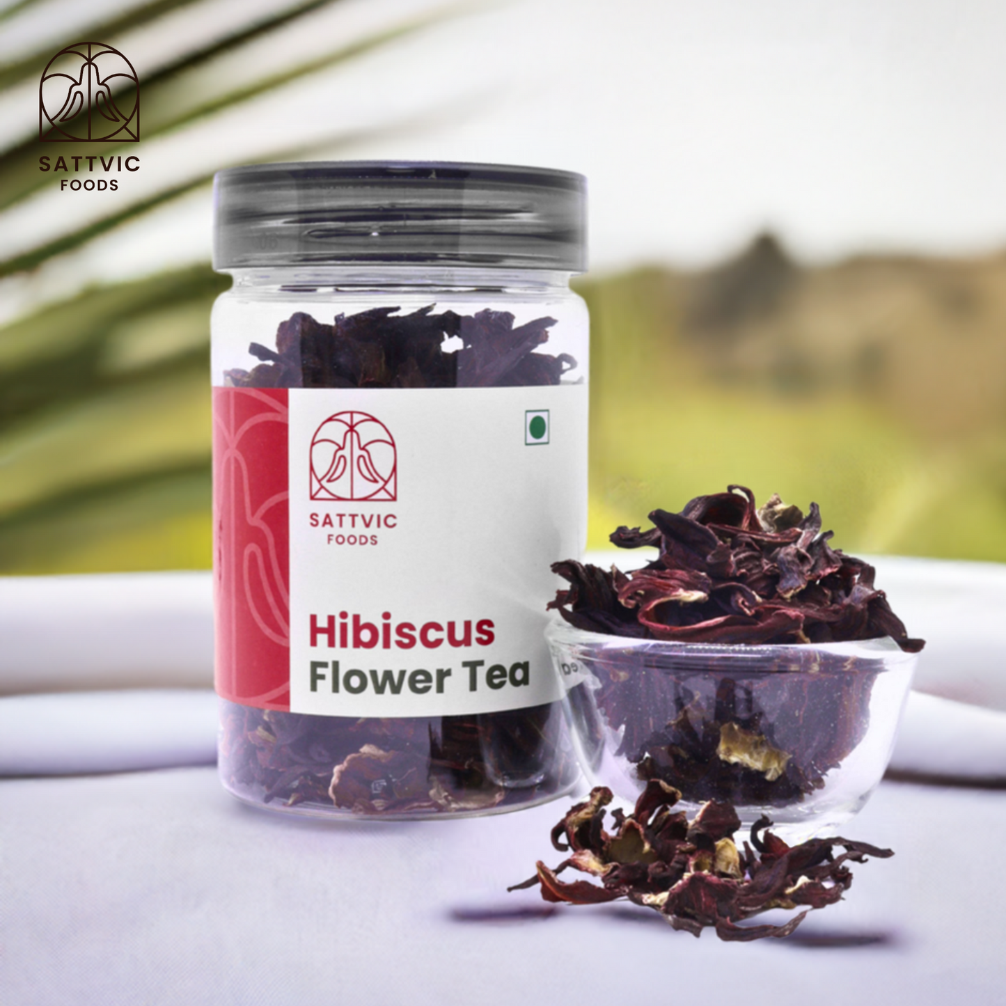 Sattvic Foods jar of loose dried hibiscus flower with a bowl beside it 