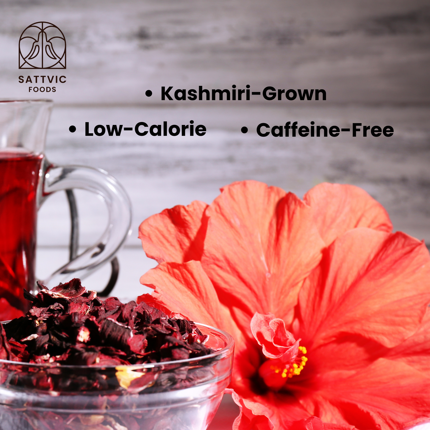 Fresh hibiscus flowers and a bowl of dried hibiscus flowers sourced from Kashmir, low in calories and caffeine-free.